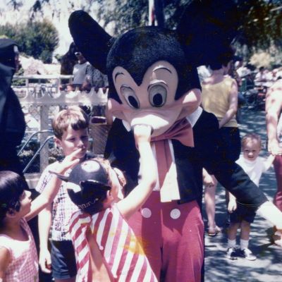 My first trip to Disneyland when I was 5 and touching Mickey’s nose (he wasn’t impressed!!!)
